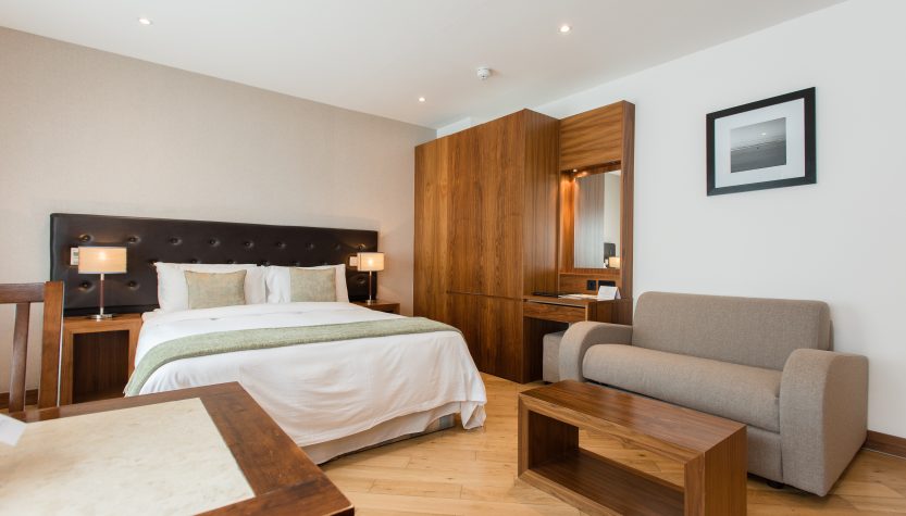 Executive Studio Apartments in Kensington with modern bedroom and living area at Presidential Apartments London