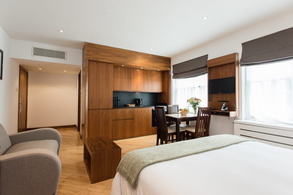 Studio apartment with sofa, kitchenette and dining area, Presidential Serviced Apartments London