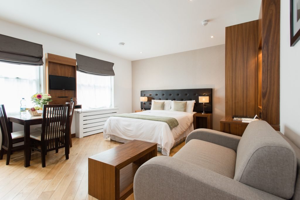 Executive studio with double bed, sofa and dining table, Presidential Serviced Apartments London